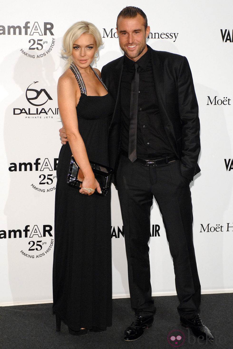 Lindsay Lohan y Philipp Plein en la gala amfAR de la Milán Fashion Week 2011